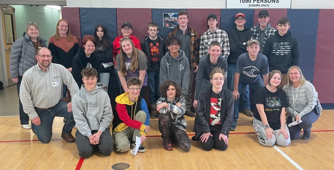 A group of people posing for a photoDescription automatically generated